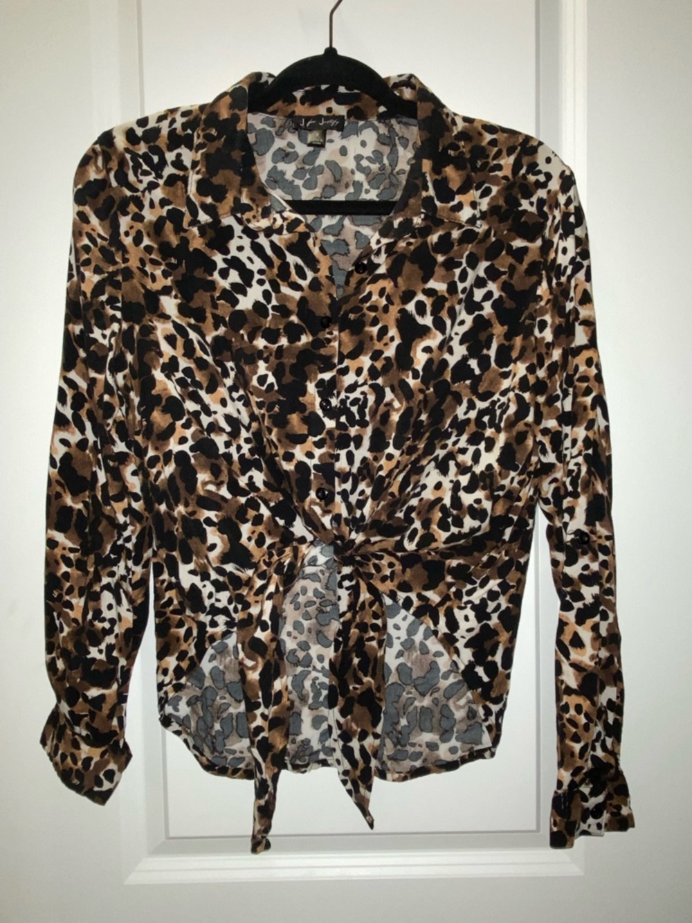 Button-down shirt featuring a leopard print and a tie-front detail.
